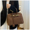 Borsa a tracolla Kelly in pelle scamosciata con finiture dorate